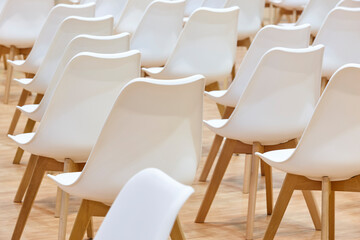 White chairs on a conference room. Modern business workspace indoor.