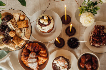 Traditional Ukrainian Easter cake. Traditional dessert. Easter cake stands on a festive table decorated with sweets. Holy Easter