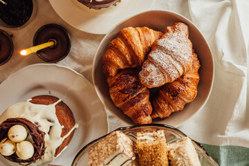 Traditional Ukrainian Easter cake. Traditional dessert. Easter cake stands on a festive table decorated with sweets. Holy Easter