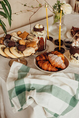 Traditional Ukrainian Easter cake. Traditional dessert. Easter cake stands on a festive table decorated with sweets. Holy Easter