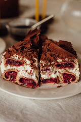 Traditional Ukrainian Easter cake. Traditional dessert. Easter cake stands on a festive table decorated with sweets. Holy Easter