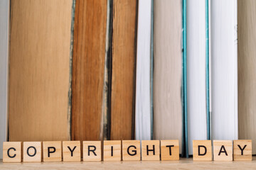On the bookshelf, the word copyright day opposite books.