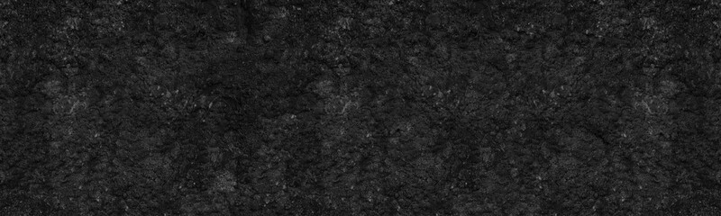 Black textured surface. Old rough wall wide long backdrop. Dark gloomy grunge abstract panoramic background