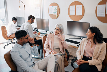 Make sure your ideas are heard. High angle shot of a diverse group of businesspeople sitting in the office together and having a discussion. - obrazy, fototapety, plakaty