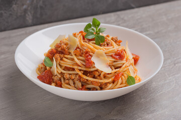 A view of a plate of spaghetti bolognese on white plate. Mediterranean cuisine. Isometric style.