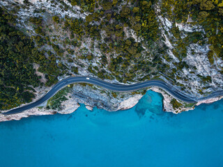 Aerial view of Aurelia street in Noli, Capo Noli and Varigotti, province of Savona. Drone photography from above of snake street snake in Liguria, north Italy, near Bergeggi and Spotorno.