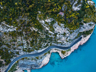 Aerial view of Aurelia street in Noli, Capo Noli and Varigotti, province of Savona. Drone photography from above of snake street snake in Liguria, north Italy, near Bergeggi and Spotorno.