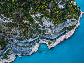 Aerial view of Aurelia street in Noli, Capo Noli and Varigotti, province of Savona. Drone photography from above of snake street snake in Liguria, north Italy, near Bergeggi and Spotorno.