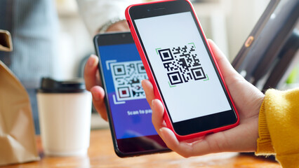 QR code payment, customer using smartphone for paying at shop