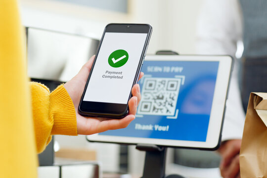 QR code payment, customer using smartphone for paying at shop