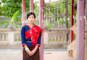 Portrait of asian girl with Thai local traditional dress, famous in countryside of Thailand,Ladies in traditional Thai costume in handmade flower baskets