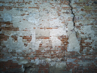 cracked brick stone wall