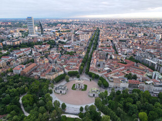 Aerial view of Arco della Pace in Milano, north Italy. Drone photography of Arch of Peace in Piazza Sempione, near Sempione park in the heart of Milan, Lombardy and Sforza Castle.
