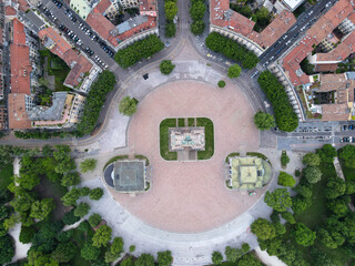 Aerial view of Arco della Pace in Milano, north Italy. Drone photography of Arch of Peace in Piazza Sempione, near Sempione park in the heart of Milan, Lombardy and Sforza Castle.