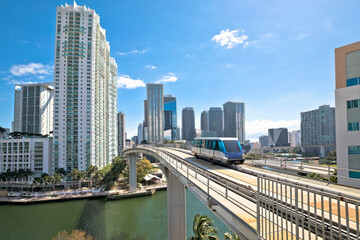Miami downtown skyline and futuristic mover train view - 497531328