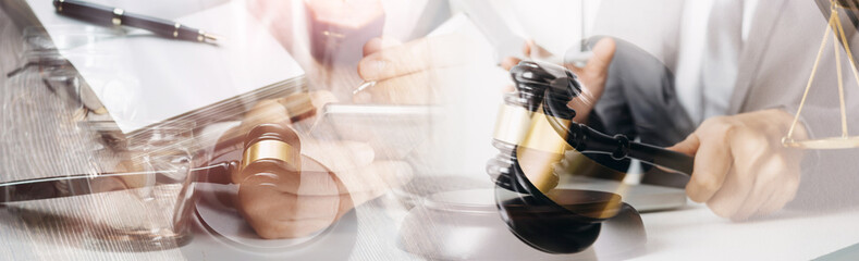 justice and law concept.Male judge in a courtroom on wooden table and Counselor or Male lawyer working in office. Legal law, advice and justice concept.