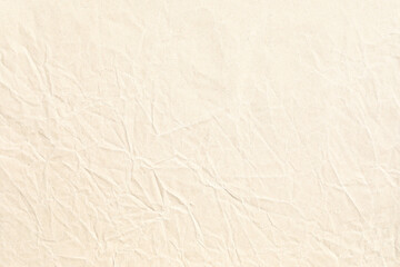 Pale brown crumpled paper background texture