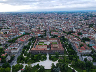 Aerial view of Castello Sforzesco (Sforza castle) in Milan. Drone photography in Lombardia. Historic medieval Sforza fortress and Arco della Pace in Sempione park, north Italy, in Europe.