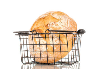 One loaf of fresh fragrant white wheat bread in a basket, close-up, isolated on a white background.