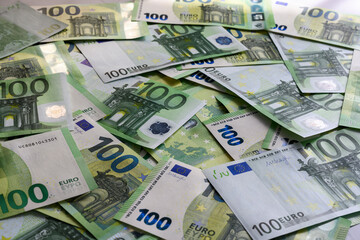 The 100 Euro banknotes are arranged in random order