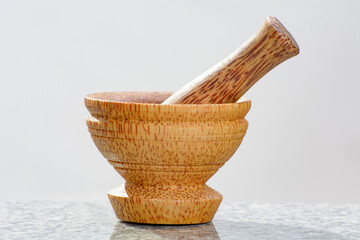 Closeup of pestle and mortar made of coconut tree