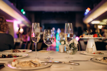 glasses with unfinished alcoholic drink at a party