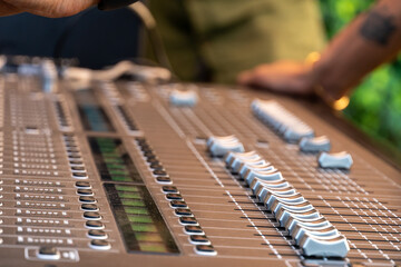 DJ mixer on a blurred background