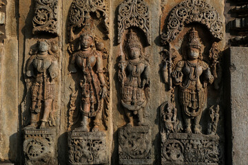 Stone Sculpture of Beautiful Female (Madanikas) with selective focus, 12th century Hindu temple,...