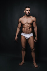 Fototapeta na wymiar Fitness male model in white underwear