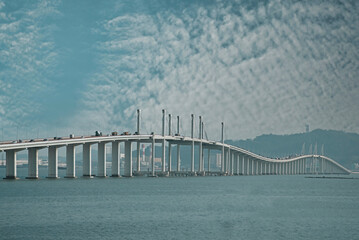 Long  bridge on a background of cloudy sky in Macau, China