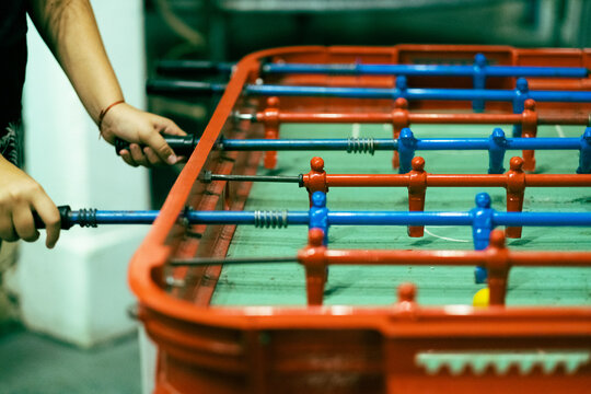 Closeup shot of a man playing table football