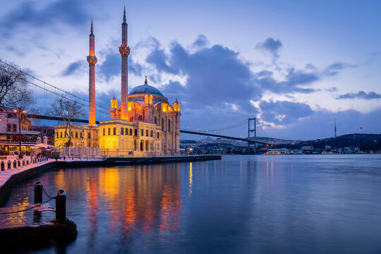 Ortakoy Mosque and Bosphorus Bridge at sunrise in winter