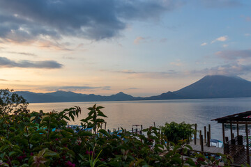 Fototapeta na wymiar Sunrise at lake atitlan from santa cruz la laguna village, touristic season in guatemala