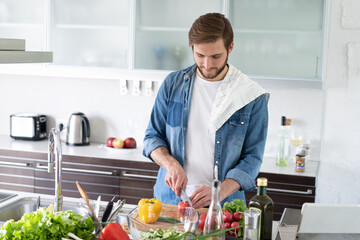 Fototapeta na wymiar Portrait of man cooking food cutting prepare hands knife preparing vegetables.