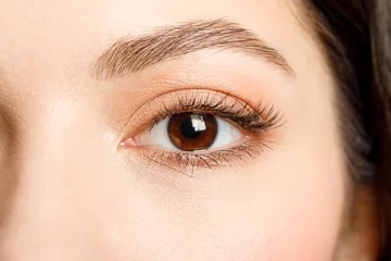 Foto op Aluminium Brown eye of a woman close-up. © Aleksandr Rybalko