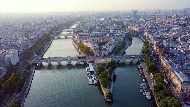 Morning aerial panoramic view on western tip of Ile de la Cite island with traffic on Pont Neuf, Paris, France.