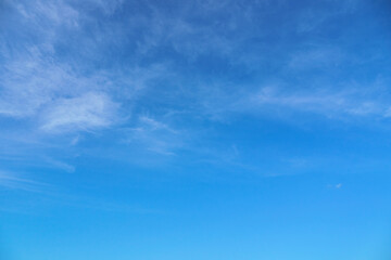 bright blue sky with clouds as abstract background