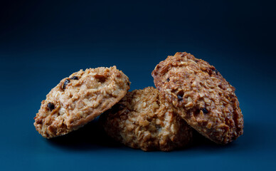Handmade oatmeal cookies on a blue background. Rustic oatmeal cookies.