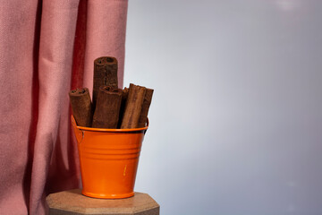 cinnamon sticks in small bucket