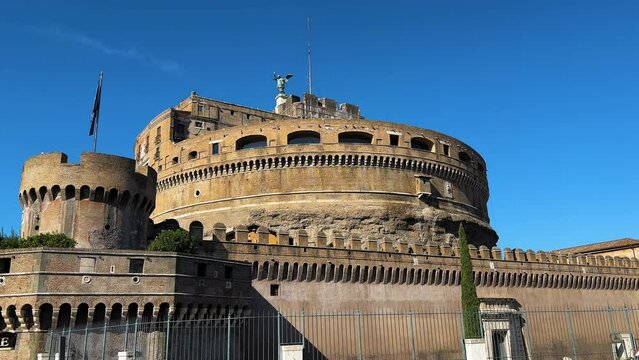 Dolly forward shot of Castel Sant'Angelo building against blue sky in Rome,Italy