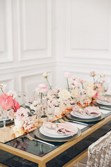 Wedding table setting with flowers and polygraphy. luxury living room. 