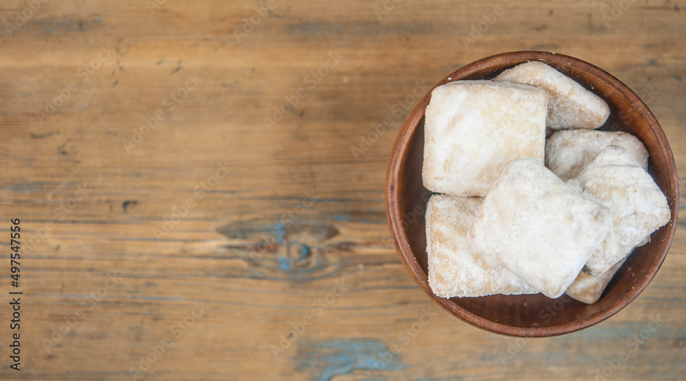 Canvas Prints short pastry cookies in wood bowl, sprinkled with powdered sugar. ready-made shortbread.