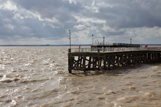 View of a pier againt the cloudy sky.