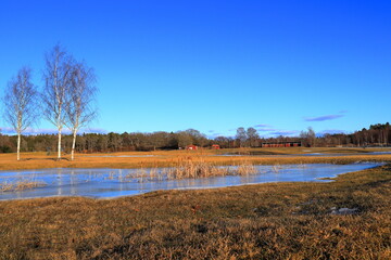 Golf course during early spring. Frozen lake or pond. Landscape photo. Before opening season....