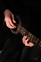 Fototapeta na wymiar professional musician playing guitar close-up of hands