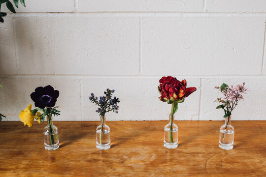 Flowers In Tiny Liquor Bottles