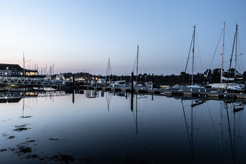 Reflections of yachts in the dock station
