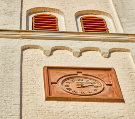 Vertical shot of the Evangelical Church Tower Clock in Geilenkirchen, Germany