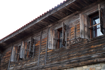 Fototapeta na wymiar wooden shutters on an old house in the tourist town of Sozopol Bulgaria