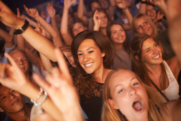 Singing every word to the song. Attractive female fans enjoying a concert- This concert was created...